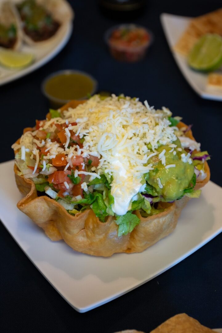 A plate of food with some cheese and other toppings